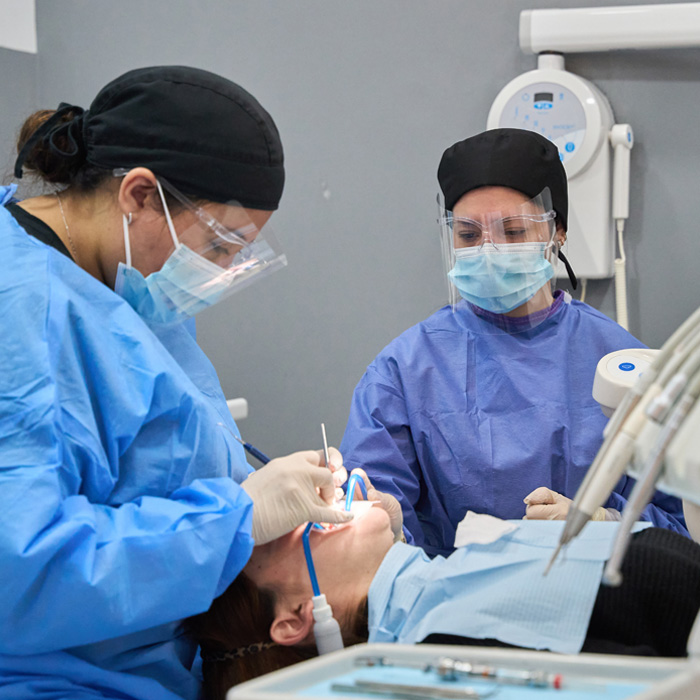 dentist performing crowns procedure in prince rupert